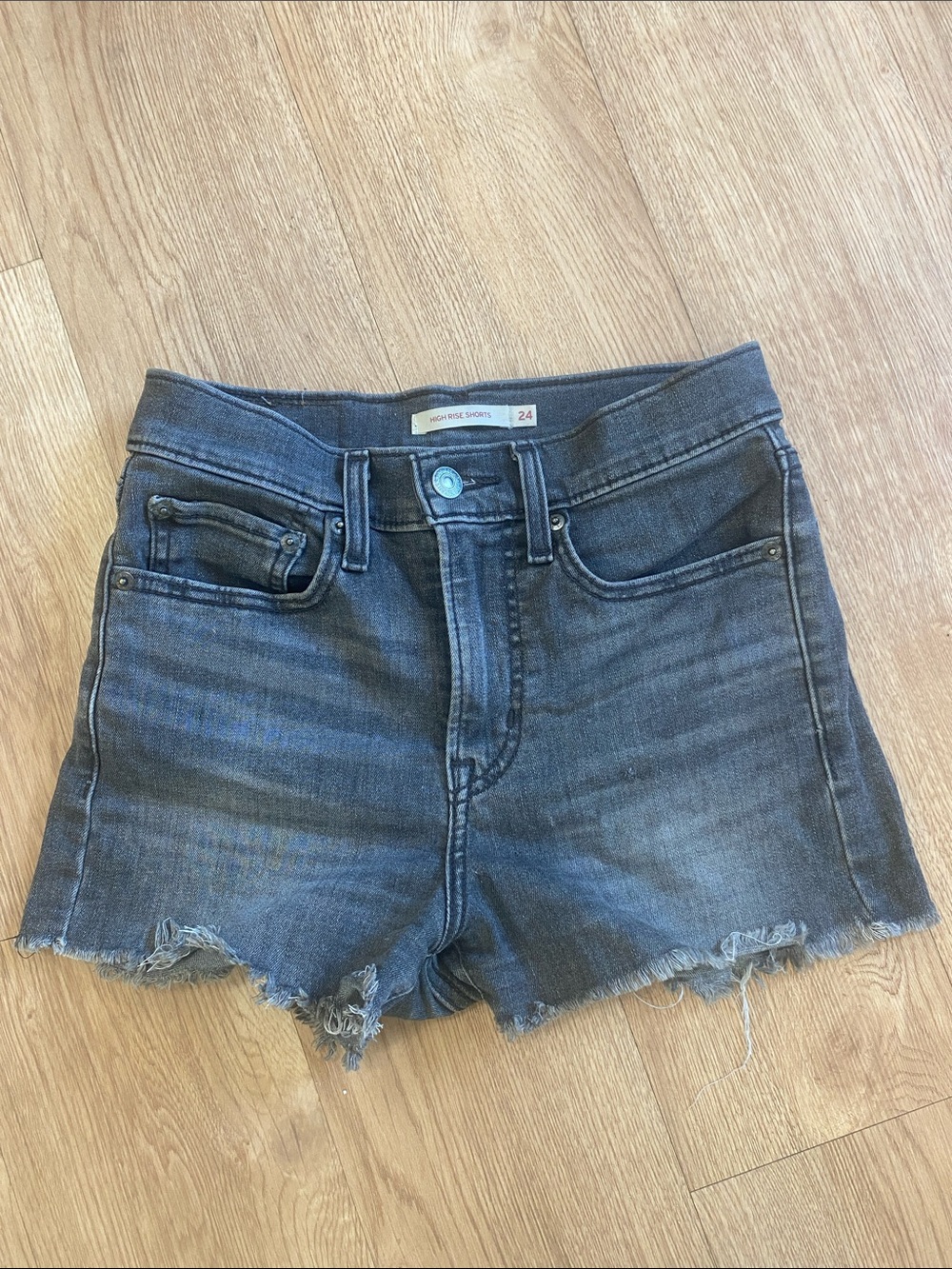 Women’s Levi’s jean shorts black 24 high rise, frayed bottoms distressed wash